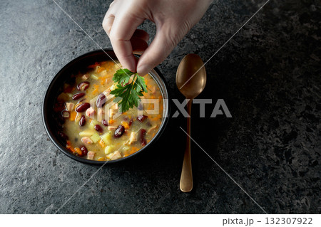 Red bean soup with potatoes, tomatoes, paprika, carrot, and bacon. Red bean soup with potatoes, tomatoes, paprika, carrot, and bacon. 132307922