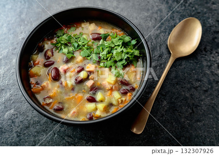 Red bean soup with potatoes, tomatoes, paprika, carrot, and bacon. Red bean soup with potatoes, tomatoes, paprika, carrot, and bacon. 132307926