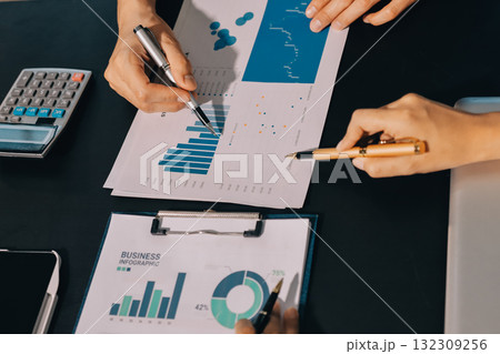 Accounting company provide finance and taxation planning for profitable cash flow, Auditor and accountant team working in office, analyze financial data and accounting record with calculator.Insight Accounting company provide finance and taxation planning for profitable cash flow, Auditor and accountant team working in office, analyze financial data and accounting record with calculator.Insight 132309256