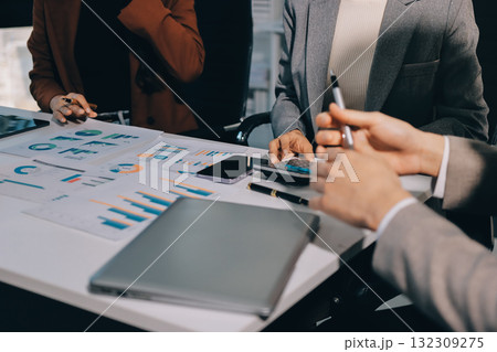 Accounting company provide finance and taxation planning for profitable cash flow, Auditor and accountant team working in office, analyze financial data and accounting record with calculator.Insight 132309275