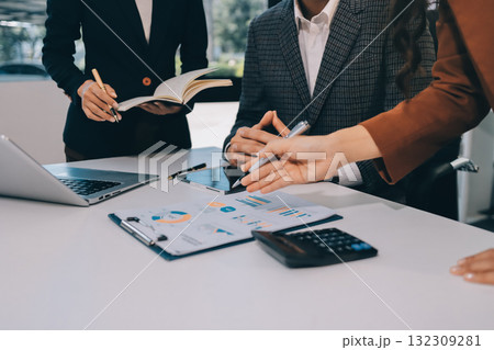 Accounting company provide finance and taxation planning for profitable cash flow, Auditor and accountant team working in office, analyze financial data and accounting record with calculator.Insight 132309281