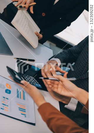 Accounting company provide finance and taxation planning for profitable cash flow, Auditor and accountant team working in office, analyze financial data and accounting record with calculator.Insight 132309282