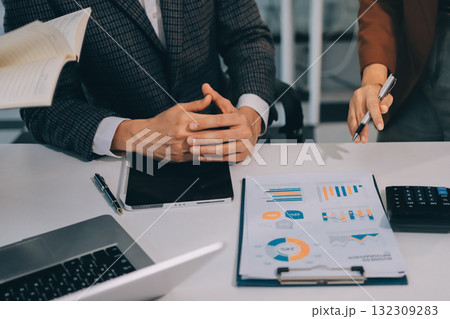 Accounting company provide finance and taxation planning for profitable cash flow, Auditor and accountant team working in office, analyze financial data and accounting record with calculator.Insight 132309283