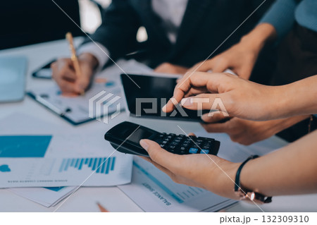 Accounting company provide finance and taxation planning for profitable cash flow, Auditor and accountant team working in office, analyze financial data and accounting record with calculator.Insight Accounting company provide finance and taxation planning for profitable cash flow, Auditor and accountant team working in office, analyze financial data and accounting record with calculator.Insight 132309310