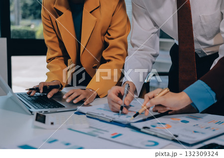 Accounting company provide finance and taxation planning for profitable cash flow, Auditor and accountant team working in office, analyze financial data and accounting record with calculator.Insight 132309324