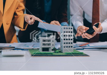 Real estate agent and customer signing contract to buy house, insurance or loan real estate.rent a house,get insurance or loan real estate or property. 132309326