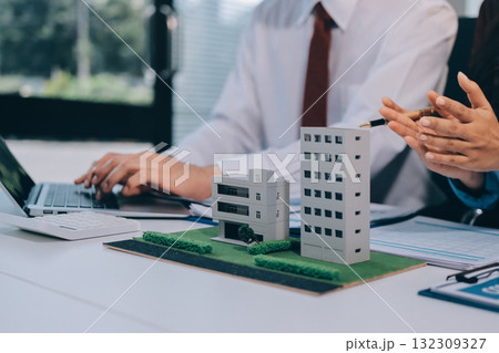 Real estate agent and customer signing contract to buy house, insurance or loan real estate.rent a house,get insurance or loan real estate or property. Real estate agent and customer signing contract to buy house, insurance or loan real estate.rent a house,get insurance or loan real estate or property. 132309327