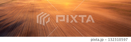 Plowed field nature background. Countryside. Rural landscape. Beautiful nature. Horizontal banner 132310597