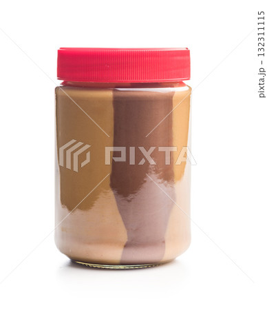 Two-tone nut chocolate spread in jar isolated on white background. Two-tone nut chocolate spread in jar isolated on white background. 132311115