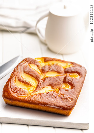 Catalana sponge cake on white table. 132311118