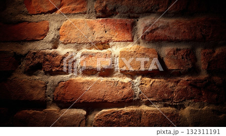 Brick wall texture with dramatic lighting and weathered mortar surface detail. Brick wall texture with dramatic lighting and weathered mortar surface detail. 132311191
