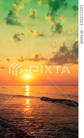 Seascape in the evening. Sunset over the sea. Dramatic sky. Natural landscape. Vertical banner Seascape in the evening. Sunset over the sea. Dramatic sky. Natural landscape. Vertical banner 132311581