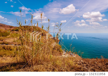 Seascape on a sunny day. Steep seashore. View from  Maro Beach Viewpoint. Nerja, Spain 132311958