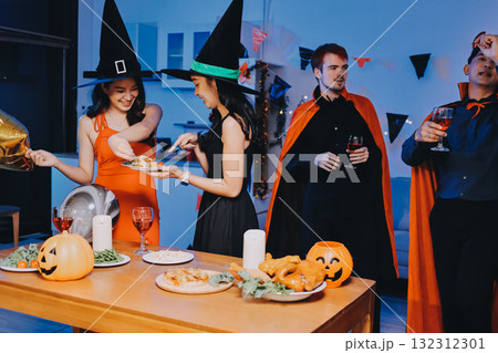 Joyful office Halloween party with coworkers in costumes, celebrating with drinks and laughter, fostering teamwork and festive spirit 132312301