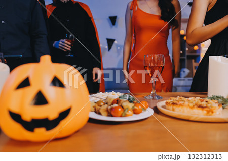 Joyful office Halloween party with coworkers in costumes, celebrating with drinks and laughter, fostering teamwork and festive spirit Joyful office Halloween party with coworkers in costumes, celebrating with drinks and laughter, fostering teamwork and festive spirit 132312313