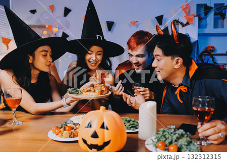 Joyful office Halloween party with coworkers in costumes, celebrating with drinks and laughter, fostering teamwork and festive spirit 132312315