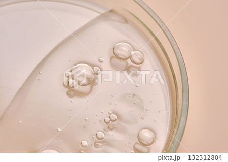 Dish detergent in a petri dish on a beige background. 132312804