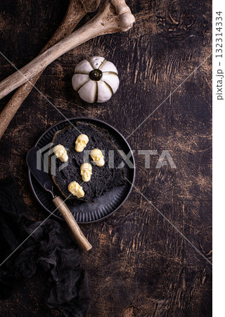 Halloween toast with butter in shape of skull Halloween toast with butter in shape of skull 132314334