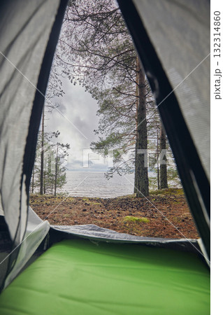 View from the tent to the lake and forest 132314860