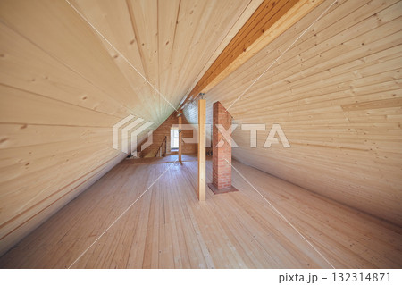 Interior: triangular attic space, finished with wooden paneling 132314871