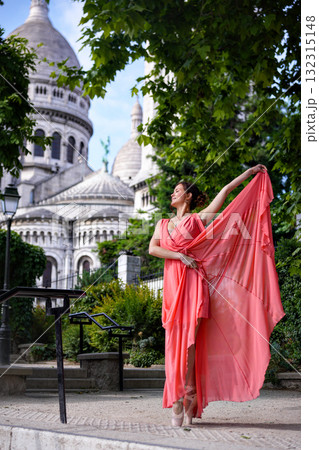 Elegant woman in red dress near Sacre Coeur in Paris 132315148