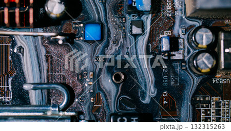 Ink flow. Digital hardware. Defocused orange blue colorful glitter water dark black electronic microchip on abstract art background. 132315263
