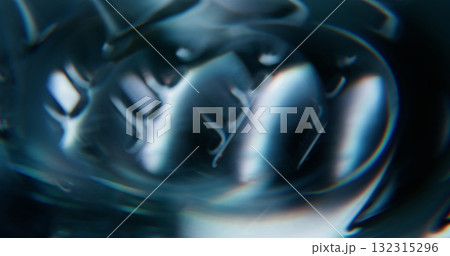 Defocused luminous twirl. Color flare. Blue radiant texture optical lens flash gleam foil circle on abstract illuminated visual art background. Defocused luminous twirl. Color flare. Blue radiant texture optical lens flash gleam foil circle on abstract illuminated visual art background. 132315296