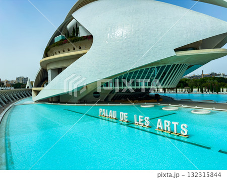 Minor architectural marvels bathed in sunlight by the sparkling waters of the Palau de les Arts in Valencia on a warm afternoon Minor architectural marvels bathed in sunlight by the sparkling waters of the Palau de les Arts in Valencia on a warm afternoon 132315844