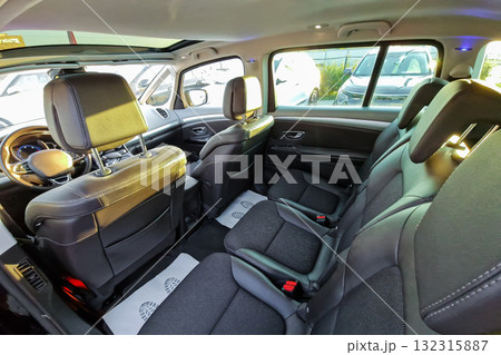Spacious interior of a modern vehicle showcasing comfortable seating arrangement and clean design in bright daylight 132315887