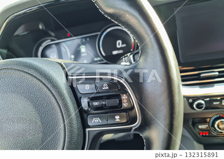 Exploring the sleek interior features of a modern car during a bright afternoon drive 132315891