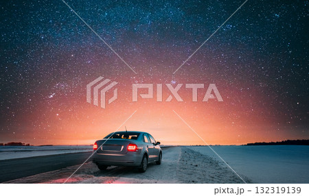 Car Sedan In Country Road At Winter Evening 132319139