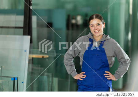 Young woman working in glass factory Young woman working in glass factory 132323057