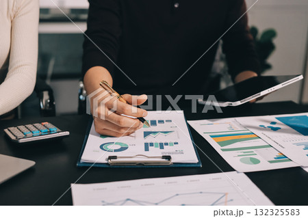 Accounting company provide finance and taxation planning for profitable cash flow, Auditor and accountant team working in office, analyze financial data and accounting record with calculator.Insight 132325583