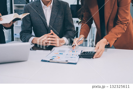 Accounting company provide finance and taxation planning for profitable cash flow, Auditor and accountant team working in office, analyze financial data and accounting record with calculator.Insight 132325611