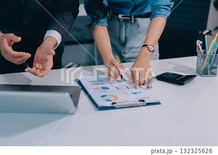 Accounting company provide finance and taxation planning for profitable cash flow, Auditor and accountant team working in office, analyze financial data and accounting record with calculator.Insight Accounting company provide finance and taxation planning for profitable cash flow, Auditor and accountant team working in office, analyze financial data and accounting record with calculator.Insight 132325626