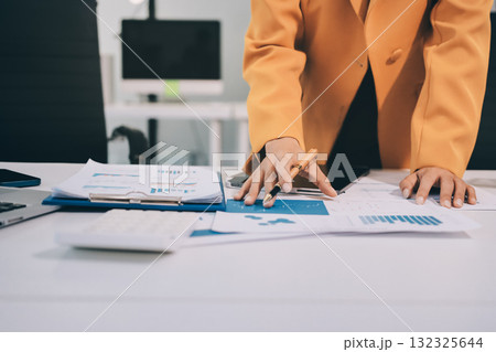 Accounting company provide finance and taxation planning for profitable cash flow, Auditor and accountant team working in office, analyze financial data and accounting record with calculator.Insight Accounting company provide finance and taxation planning for profitable cash flow, Auditor and accountant team working in office, analyze financial data and accounting record with calculator.Insight 132325644
