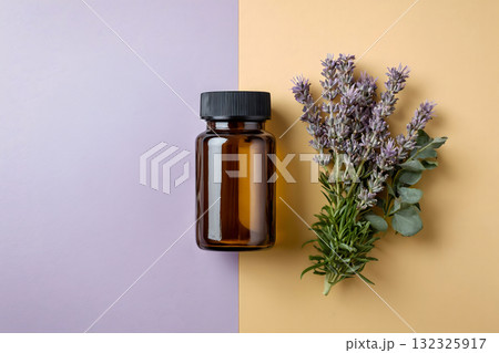Lavender Essential Oil Bottle and Herb on Split Background 132325917
