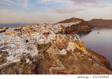 Aerial drone photo capturing the famous white-washed architecture and the volcanic caldera Santorini 132329487