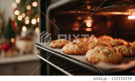 Delicious cookies bake inside the oven, glowing golden as the holiday season brings warmth and joy to the kitchen atmosphere 132330339