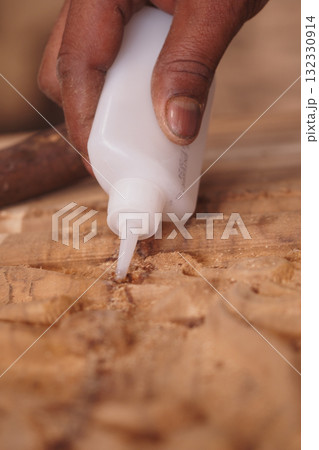 Crafting with care using adhesive in woodworking process 132330914