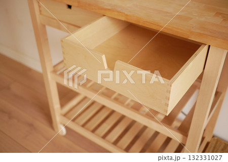 Wooden kitchen cart with an open drawer design Wooden kitchen cart with an open drawer design 132331027