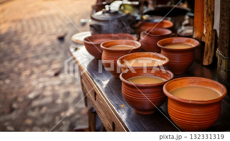 India Street Food, Roadside stall serving piping hot masala chai in clay cups., copy space India Street Food, Roadside stall serving piping hot masala chai in clay cups., copy space 132331319