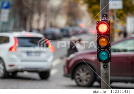 traffic light on the street junction with beautiful bokeh, city with cars in the background traffic light on the street junction with beautiful bokeh, city with cars in the background 132331435