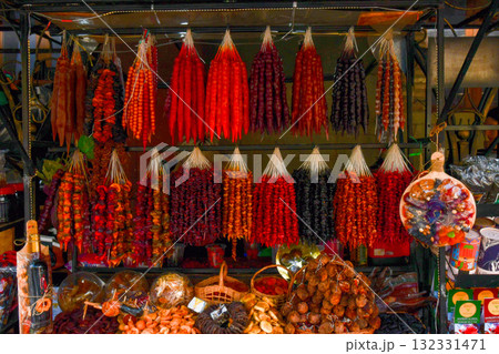 Traditional Georgian food sausage-shaped candy churchkhela hanging in market. 132331471