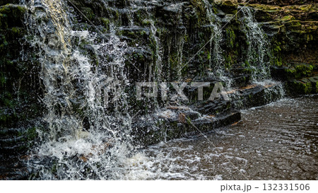 beautiful view in spring of a waterfall on small river Ivande in Latvia 132331506