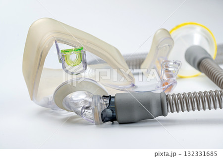 Respiratory mask for sleep disorders isolated over white. Apnea. Air pump. Assisted breathing. 132331685