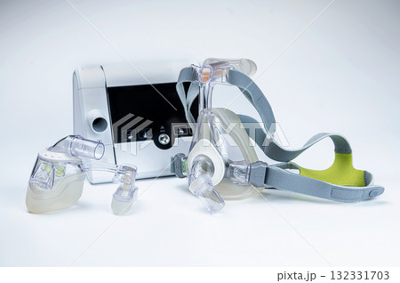 Continuous positive airway pressure system includes of CPAP machine, mask, tube on white background. Continuous positive airway pressure system includes of CPAP machine, mask, tube on white background. 132331703