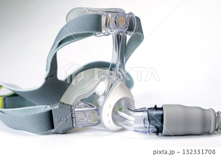 Continuous positive airway pressure- mask (CPAP) and hose isolated on white background Continuous positive airway pressure- mask (CPAP) and hose isolated on white background 132331708