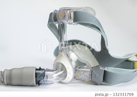 Continuous positive airway pressure- mask (CPAP) and hose isolated on white background Continuous positive airway pressure- mask (CPAP) and hose isolated on white background 132331709