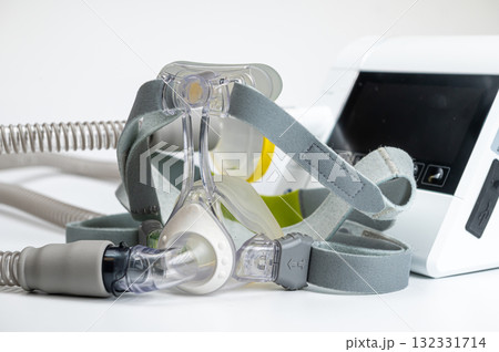 Continuous positive airway pressure system includes of CPAP machine, mask, tube on white background. Continuous positive airway pressure system includes of CPAP machine, mask, tube on white background. 132331714